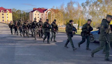 Security forces with machine guns cordon off the Bancheny Monastery