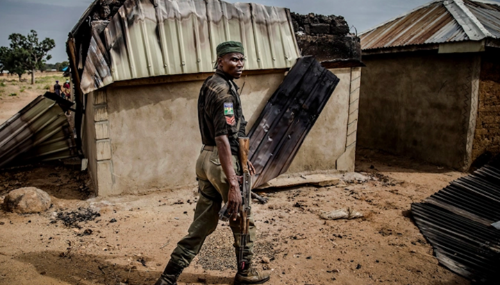Nigerian police patrol an area of destroyed and burned houses after a Fulani attack. Photo: Christian Post